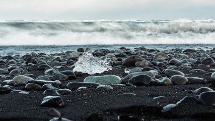Diamond Beach in Iceland. Black sand beach with iceberg fragments. Breiðamerkurjökull glacier...