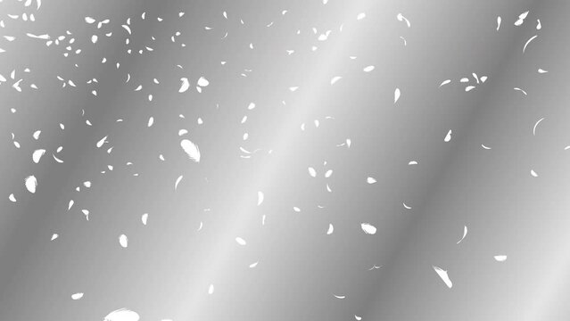 White feather particles flowing in the wind on silver gradient background. Abstract background.