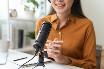 Close-up microphone on the table in podcasting record.