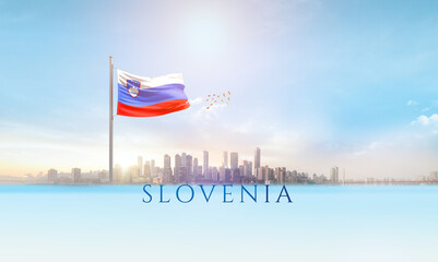 Slovenia national flag waving in beautiful building skyline.