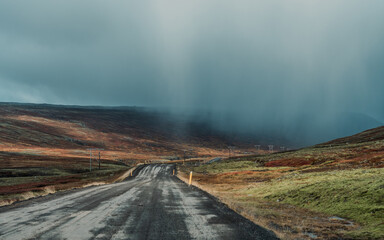 Long asphalt road runs through Iceland. Travelling, exploring, breathtaking views, volcanic...