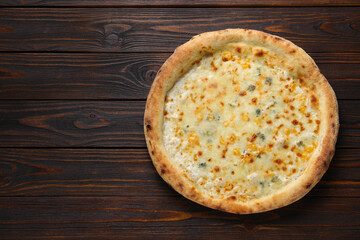 Delicious cheese pizza on wooden table, top view. Space for text