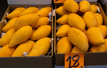Basket with mangoes at the fruit market