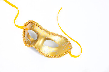 golden colored masquerade mask, isolated on white