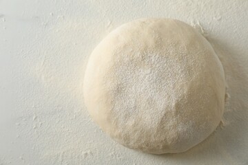 Fresh raw homemade dough on table, top view. Space for text