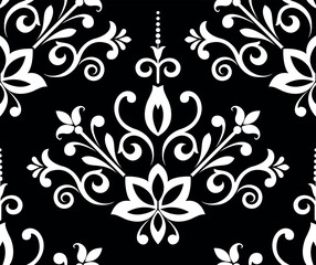Obraz premium Wallpaper in the style of Baroque. Seamless vector background. White and black floral ornament. Graphic pattern for fabric, wallpaper, packaging. Ornate Damask flower ornament.