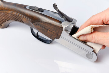 cleaning and lubricating the receiver of a double-barreled shotgun