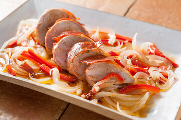 Beef sirloin with baked ham with pepper and onion