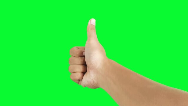 Thumb up hand gesture isolated on green screen chroma key background
