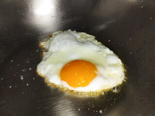 fried egg in a sunny side up in a frying pan