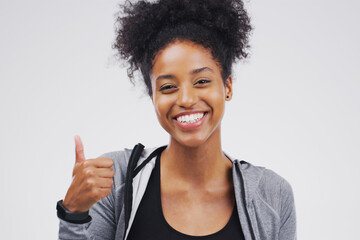 Studio, portrait and black woman with thumbs up for approval, deal and yes with mockup. Agreement,...
