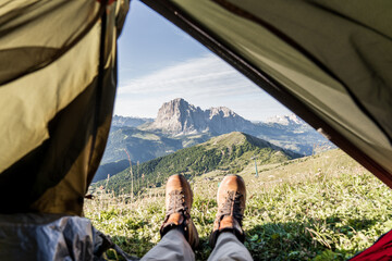 First-person view of a mountain range from a mountaintop tent