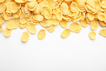 Breakfast cereal. Tasty corn flakes on white background, flat lay. Space for text