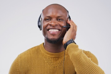 African man, smile and studio with headphones for customer service or call center, smile for...