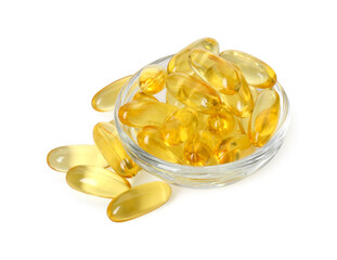Vitamin capsules in bowl isolated on white. Health supplement