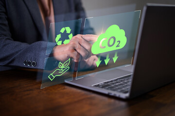 Reduce co2 emission. man using software to lower CO2 emissions to limit global warming and climate...