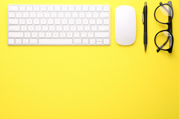 Flat lay composition with office stationery on yellow background, space for text