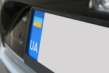 Fototapeta premium Car with vehicle registration plate, closeup view