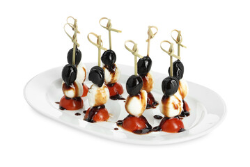 Tasty canapes with black olives, mozzarella and cherry tomatoes isolated on white