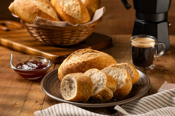 French bread in the basket with butter and rustic background