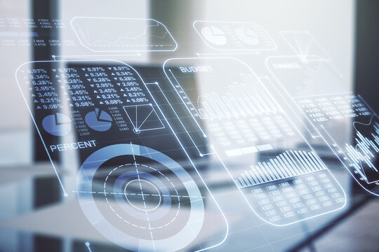 Multi exposure of creative statistics data hologram on laptop background, stats and analytics concept