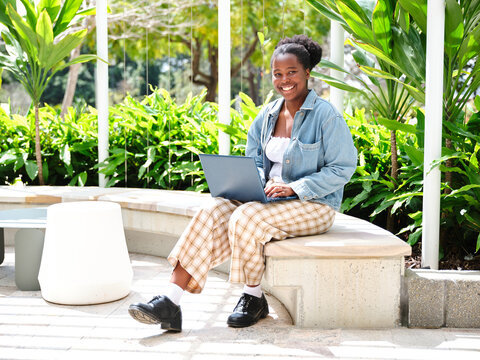 Young African woman using a computer on university campus