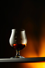 Brandy snifter on a dark background.