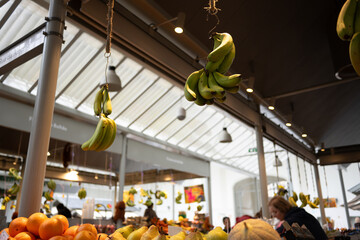 Bunch of bananas hanging from ceiling