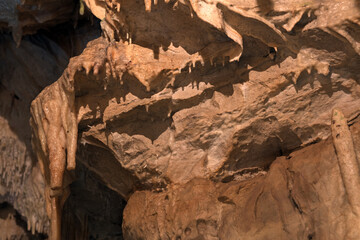 Inside limestone cave - different morphological elements created by driping or flowing water and calsium dioxide: stalagmites, stalactites, pipes, karst landscape, flowstones