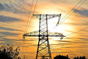 High voltage line and sunset