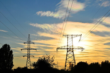 High voltage line and sunset