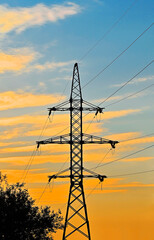 High voltage line and sunset