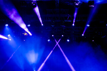 Blue and purple lights on the concert stage.