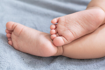 Baby feet,Parents hold in the hands and feet of the newborn baby. 