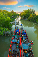 Mangrove forests and small fishing boats in Asia