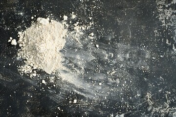 Flour on a black background,  Top view,  Copy space