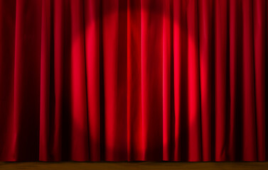 Stage with closed maroon red curtain with spotlight