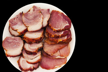 Smoked bacon and minced slices of ham on a plate