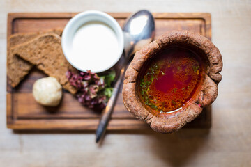 Borsch, traditional ukrainian soup served in bread bowl. Restaurant top view