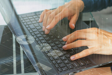 Close up shot of the woman with beautiful hands in the business attire, working on the laptop in...