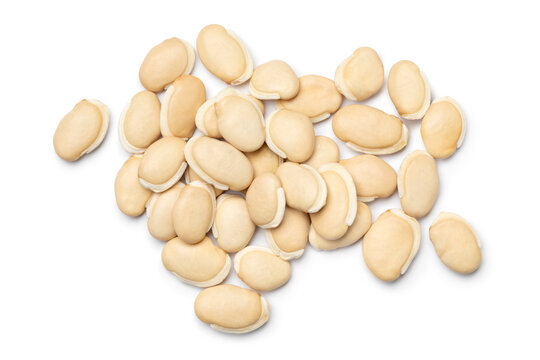 Heap of dried lablab beans close up isolated on white background