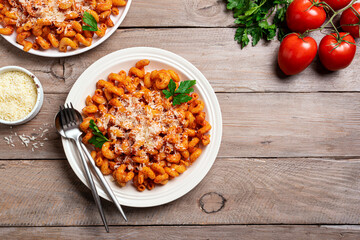 Cavatappi pasta with tomato sauce and parmesan cheese