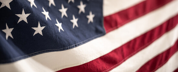 A detailed view of the American Flag with selective focus on the stars and stripes.