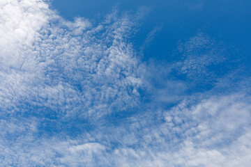 Ornamental clouds. Dramatic sky. Epic storm cloudscape. Soft sunlight. copy space. Meteorology, heaven, hope, peace concept