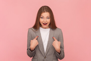 Portrait of surprised astonished woman with brown hair pointing at herself with big eyes, can't...