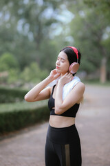 Asian woman exercising in the park Her gaze was determined to lose weight. The concept of healthy lifestyle activities