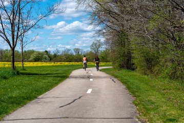 Bicycle Riders Enjoying A Spring Day On A Wisconsin Trail