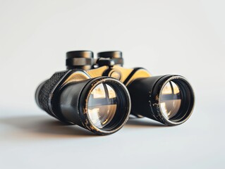 A pair of binoculars on a white background. - Powered by Adobe
