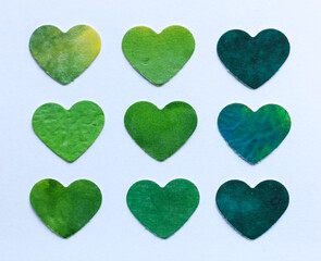 Green hearts in watercolor style isolated on white background. Handmade.