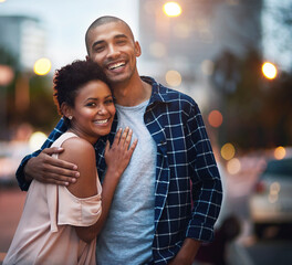 Happy couple, portrait and hug for city travel at night or downtown date for relationship, bokeh or...